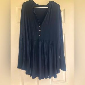 Black babydoll swing blouse. Long sleeves, v neck. Never worn, never washed.